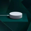 White circular Xiaomijia smart home gateway with UK plug, 90mm diameter wireless wall switch