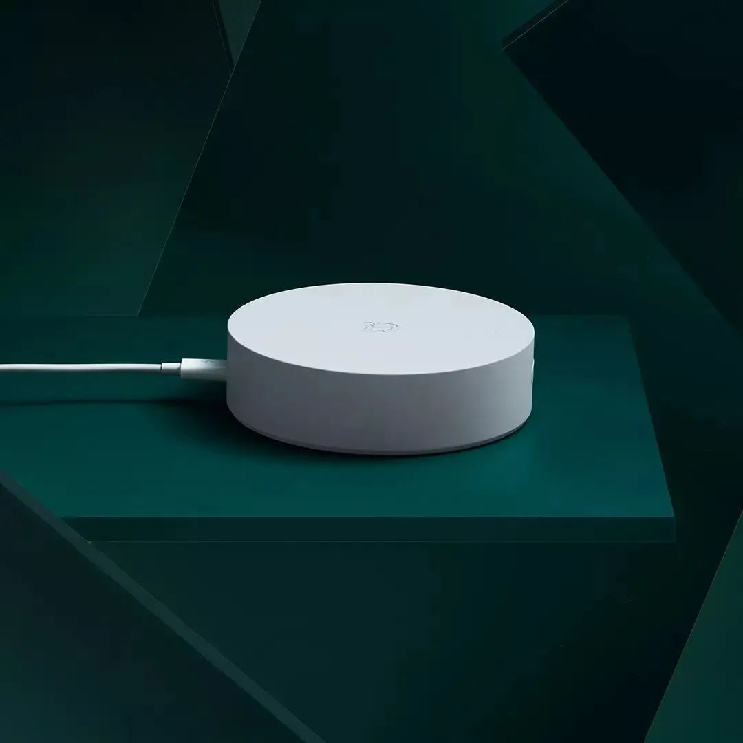 White circular Xiaomijia smart home gateway with UK plug, 90mm diameter wireless wall switch