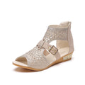 Women's beige sandals with wedge heel and back zipper closure showing fish mouth toe shape