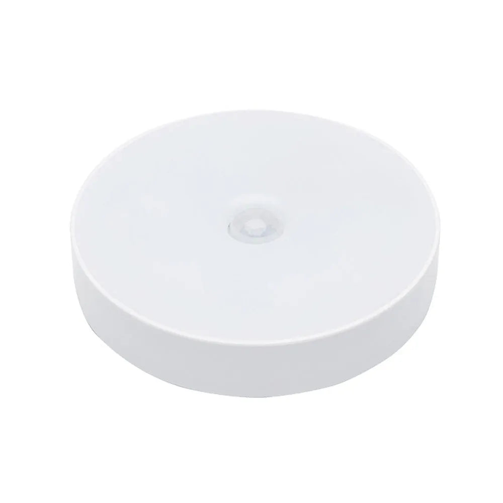 USB rechargeable motion sensing LED night light in beige or white with compact circular design