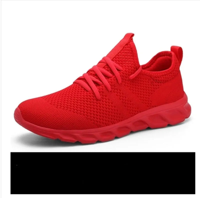Men's black and white casual sneakers with mesh upper and lace-up closure for jogging.