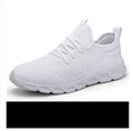 Men's black and white casual sneakers with mesh upper and lace-up closure for jogging.