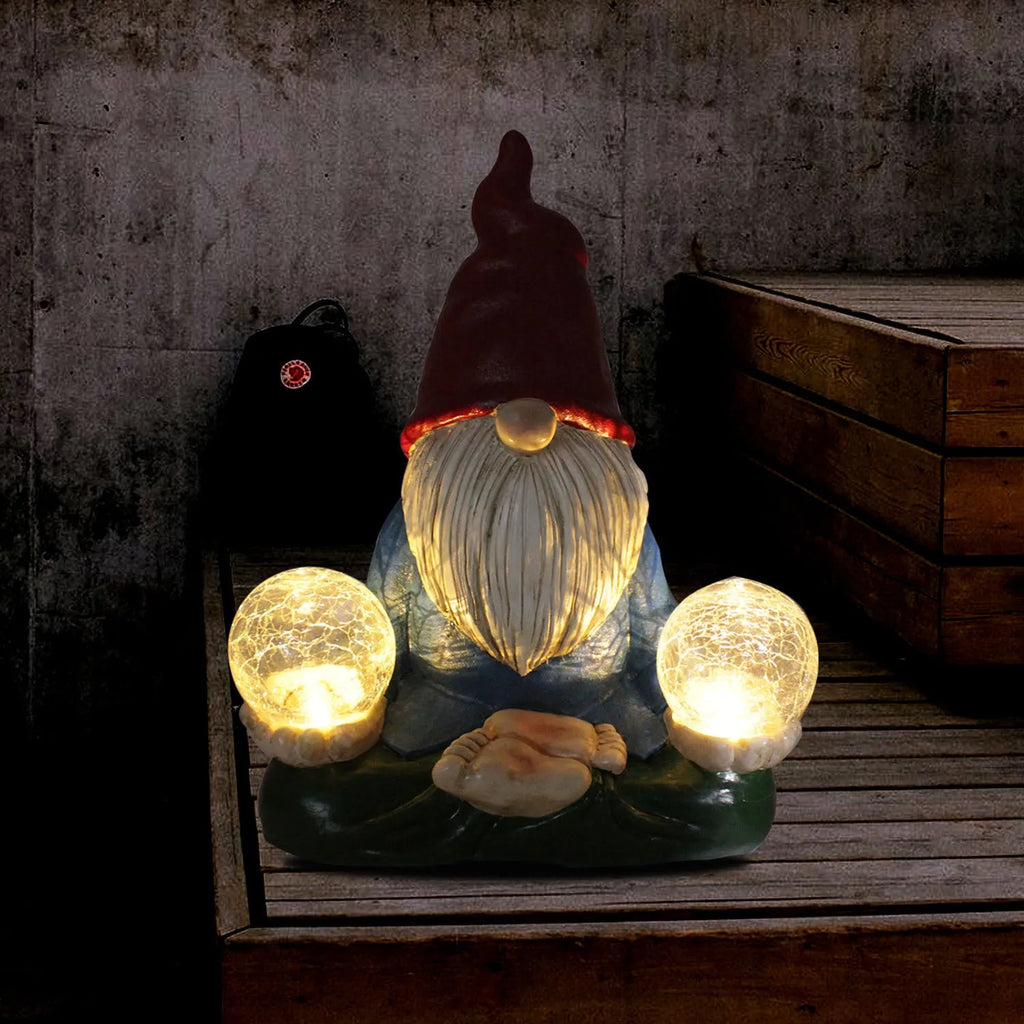 Solar LED resin dwarf garden statue with faceless old man design on grass