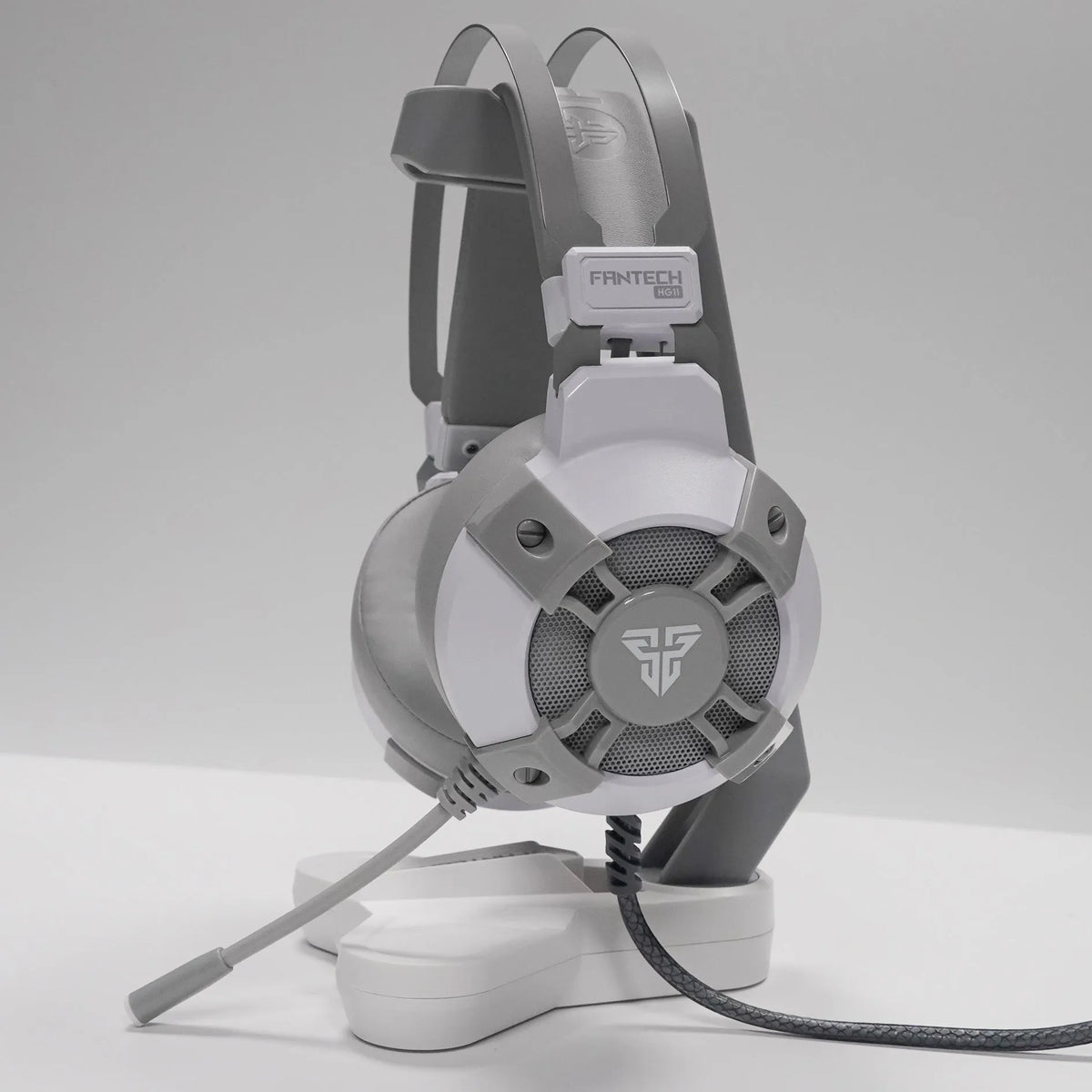 Black FANTECH HG11 USB gaming headset with large ear cups, RGB lighting, and a 2.1m cable with inline remote control.