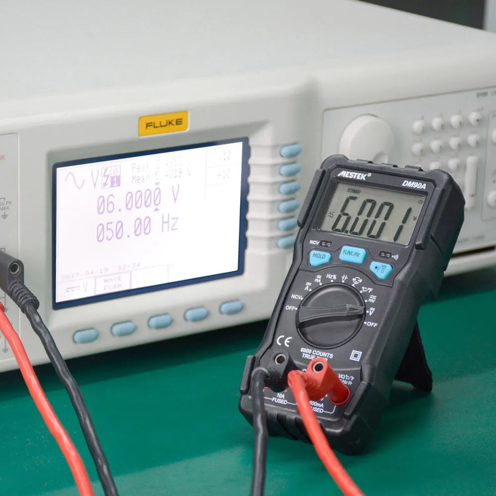 DM90A digital multimeter with display, test leads, and thermocouple for temperature measurement.