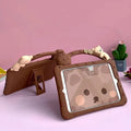 Brown cartoon silicone protective sleeve case for iPad tablets on a flat surface
