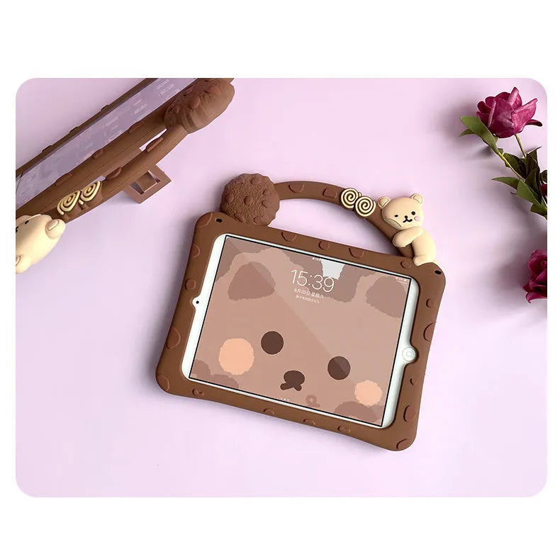 Brown cartoon silicone protective sleeve case for iPad tablets on a flat surface