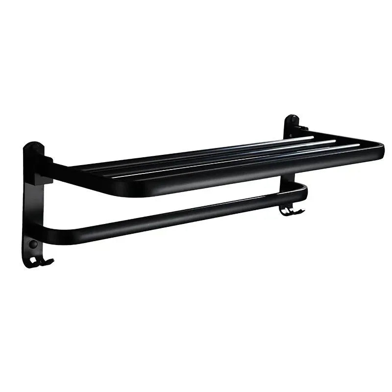 Aluminium double-layer folding bathroom shelf with hooks on a light-coloured wall.
