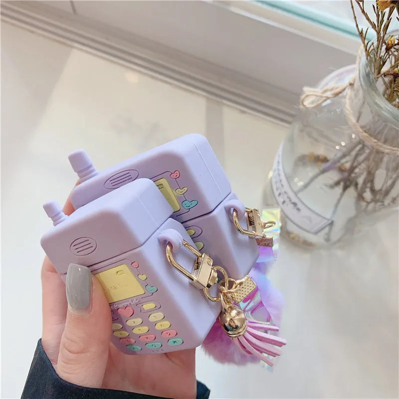 Purple silicone protective case for Apple AirPods with attached fur ball pendant