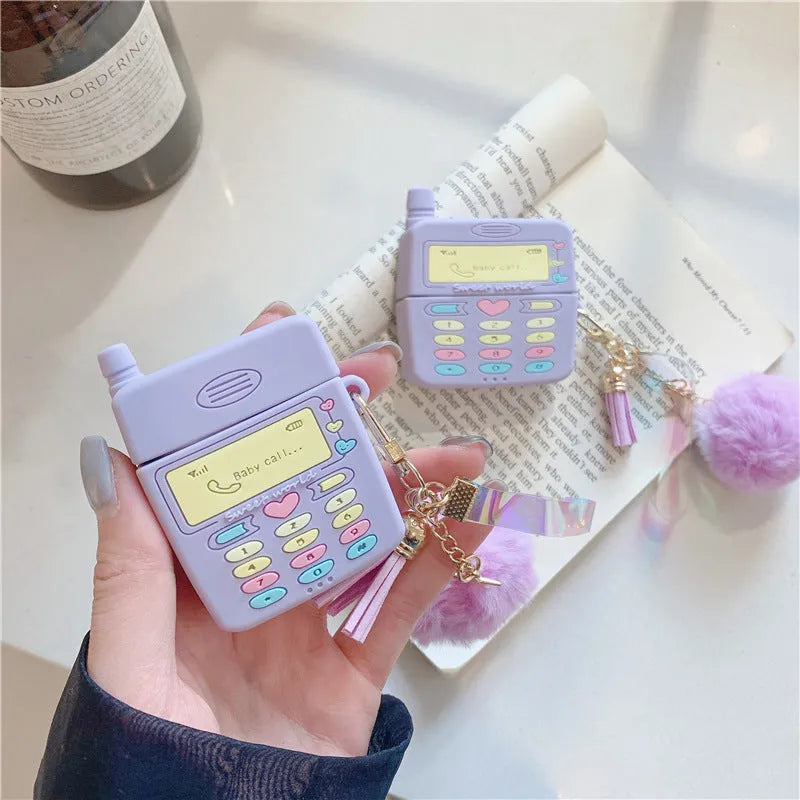 Purple silicone protective case for Apple AirPods with attached fur ball pendant