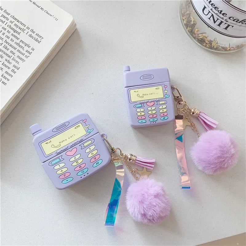 Purple silicone protective case for Apple AirPods with attached fur ball pendant