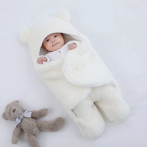 Cotton blend baby quilted sleeping bag wrapper in grey, shown laid flat.