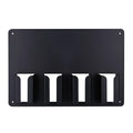 Black plastic wall-mounted frame holding four electric hair clippers
