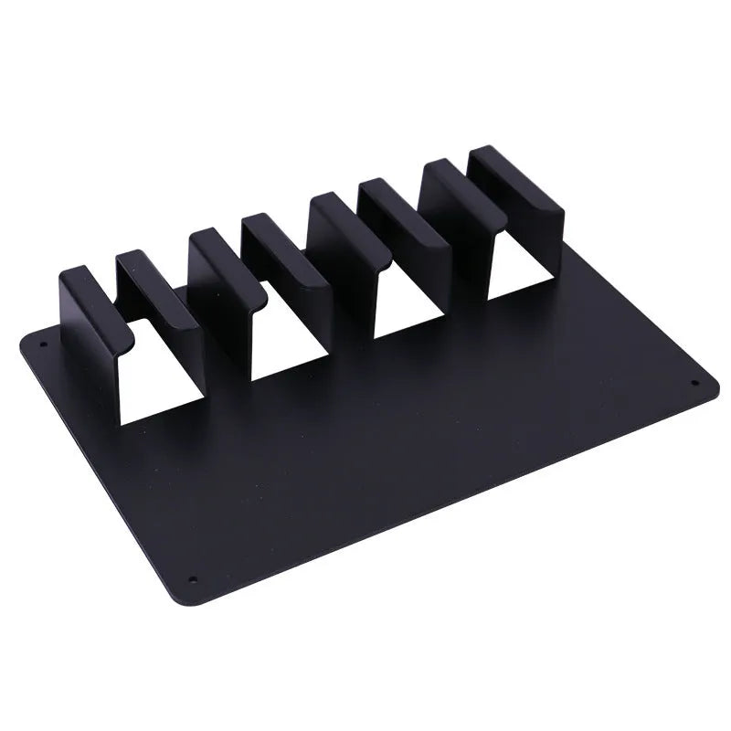 Black plastic wall-mounted frame holding four electric hair clippers