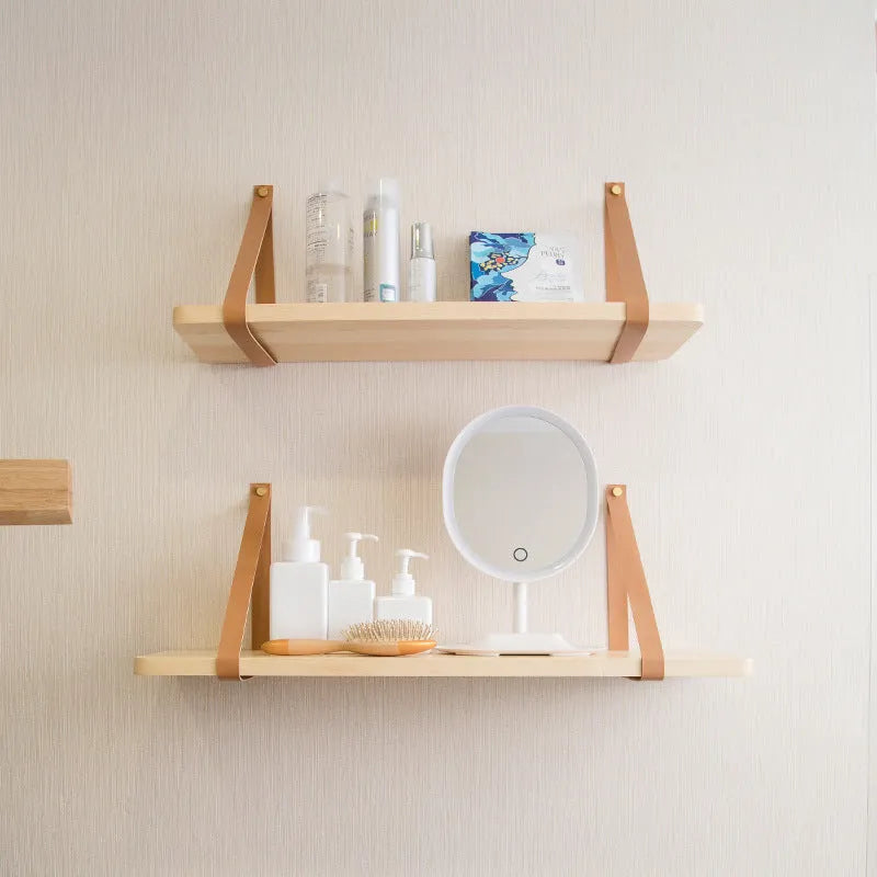 Nordic style pine wall mounted bookshelf measuring 50x16cm holding books and decor
