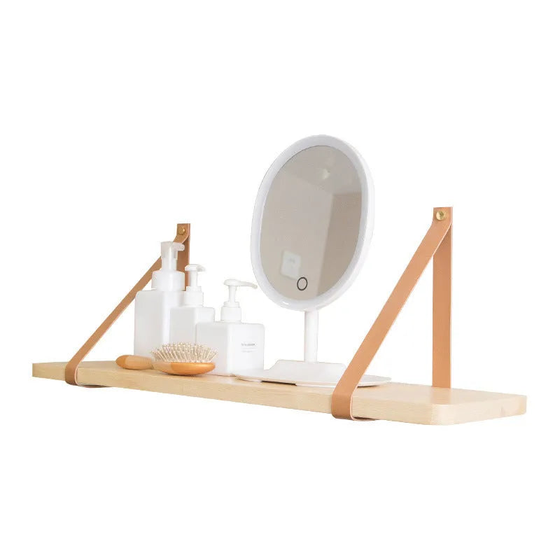 Nordic style pine wall mounted bookshelf measuring 50x16cm holding books and decor