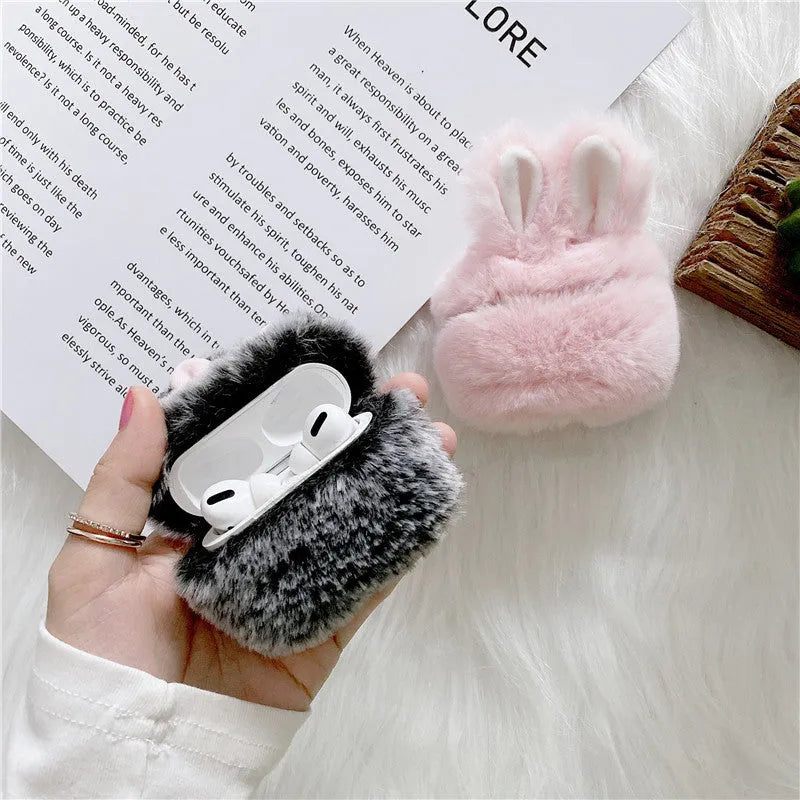 Pink rabbit ear silicone protective cover on Apple AirPods charging case