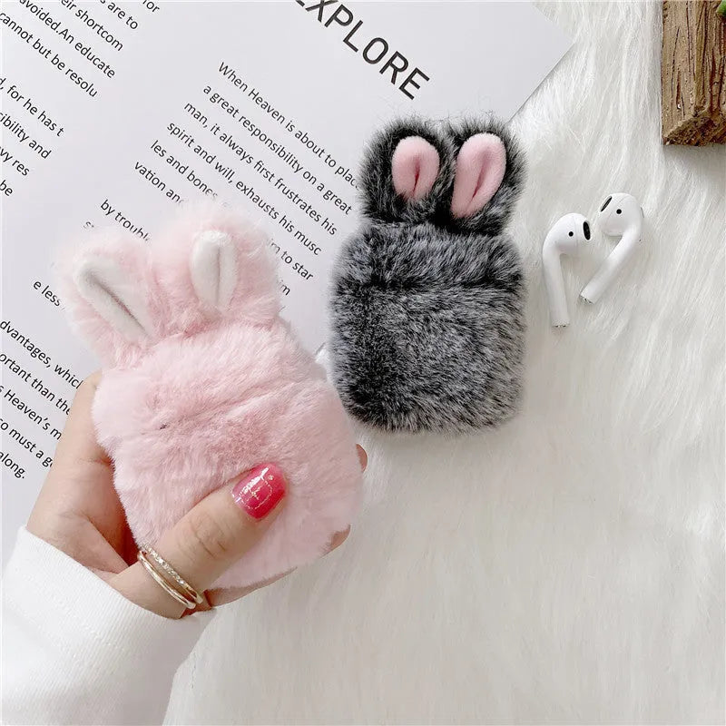 Pink rabbit ear silicone protective cover on Apple AirPods charging case
