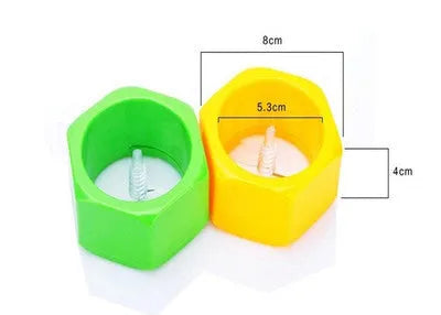 Yellow and green plastic vegetable spiral slicer for cucumbers on a kitchen counter.