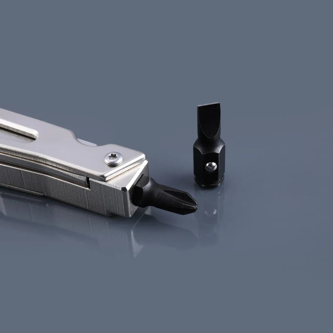 White stainless steel multi-function tool showing wrench, knife blade, and needle nose pliers jaws