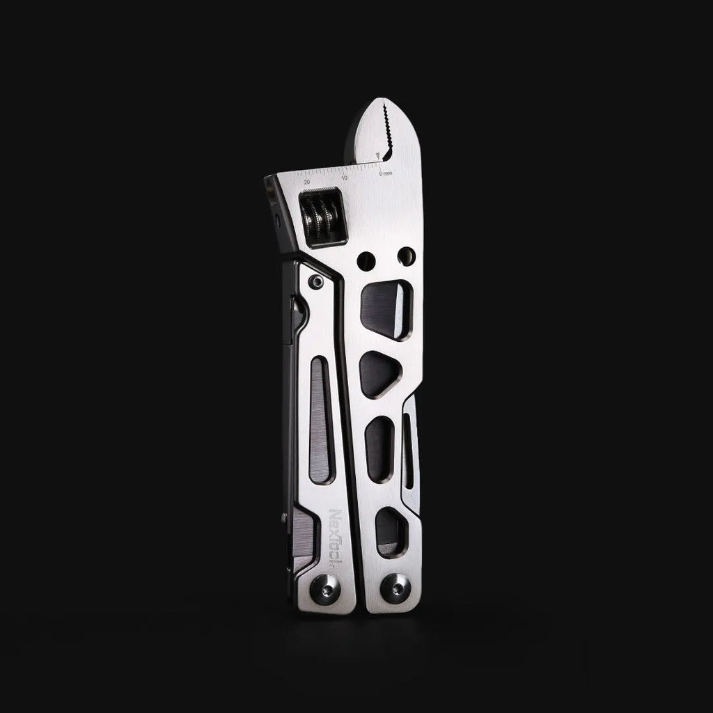 White stainless steel multi-function tool showing wrench, knife blade, and needle nose pliers jaws