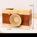 Wooden rotating camera music box in a miniature carton gift box.