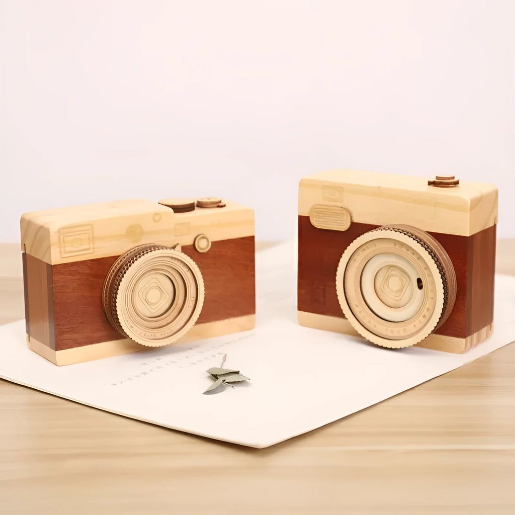 Wooden rotating camera music box in a miniature carton gift box.