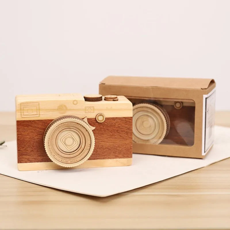 Wooden rotating camera music box in a miniature carton gift box.