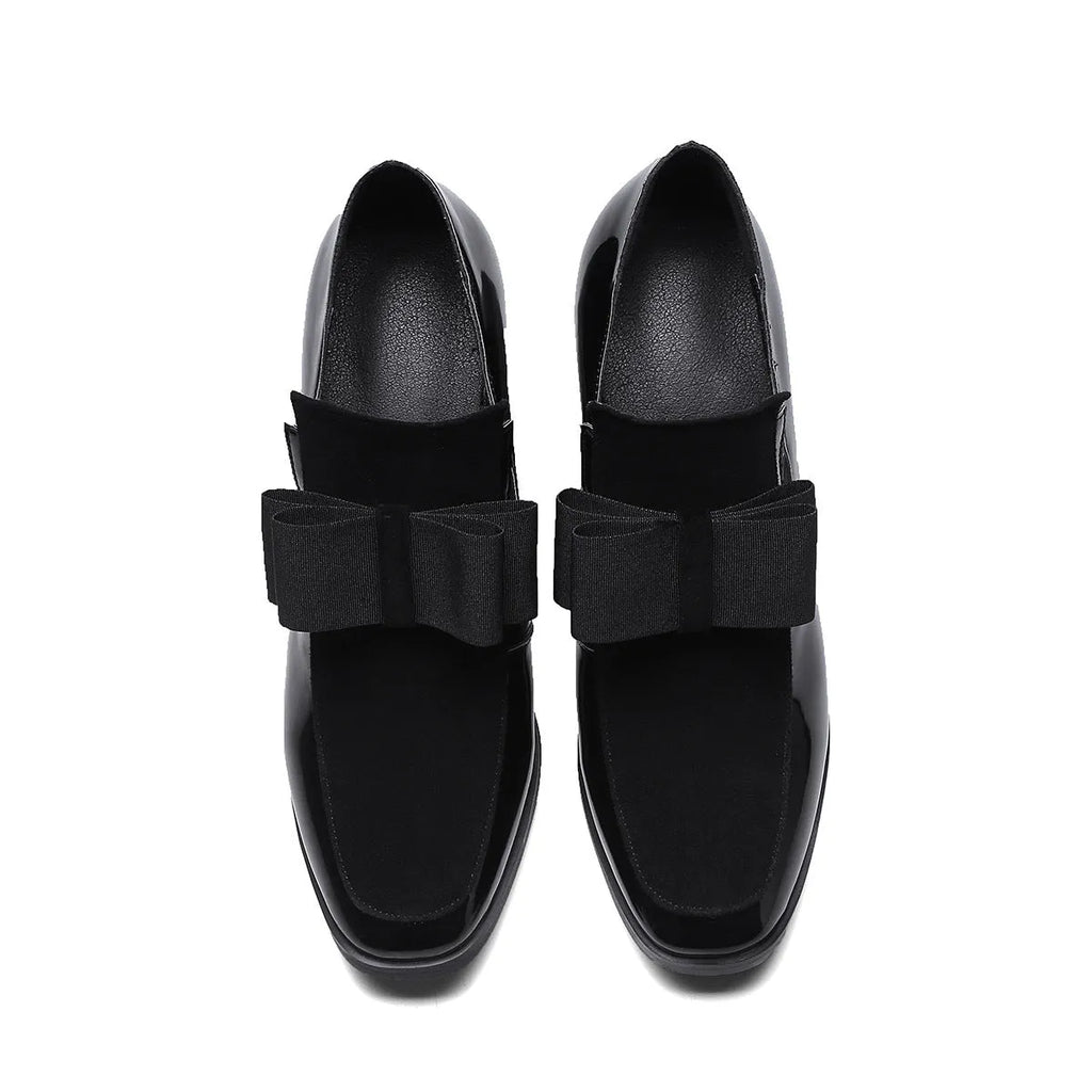 Women's black patent leather high heel shoes with a thick block heel and square toe, shown in a large size.