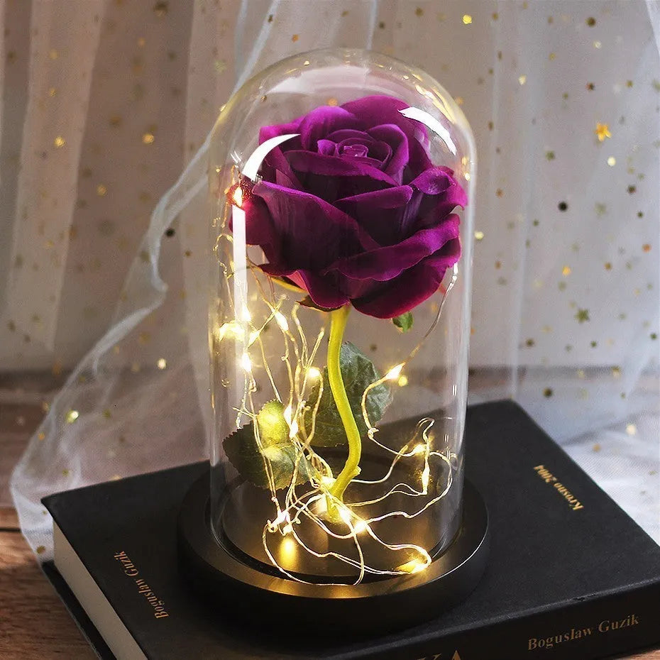 Silk rose bouquet LED ornament with glass cover and warm white lighting on wood base