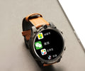 Black smart phone watch with 1.6-inch screen, wrist strap, dual camera, and heart rate monitor.