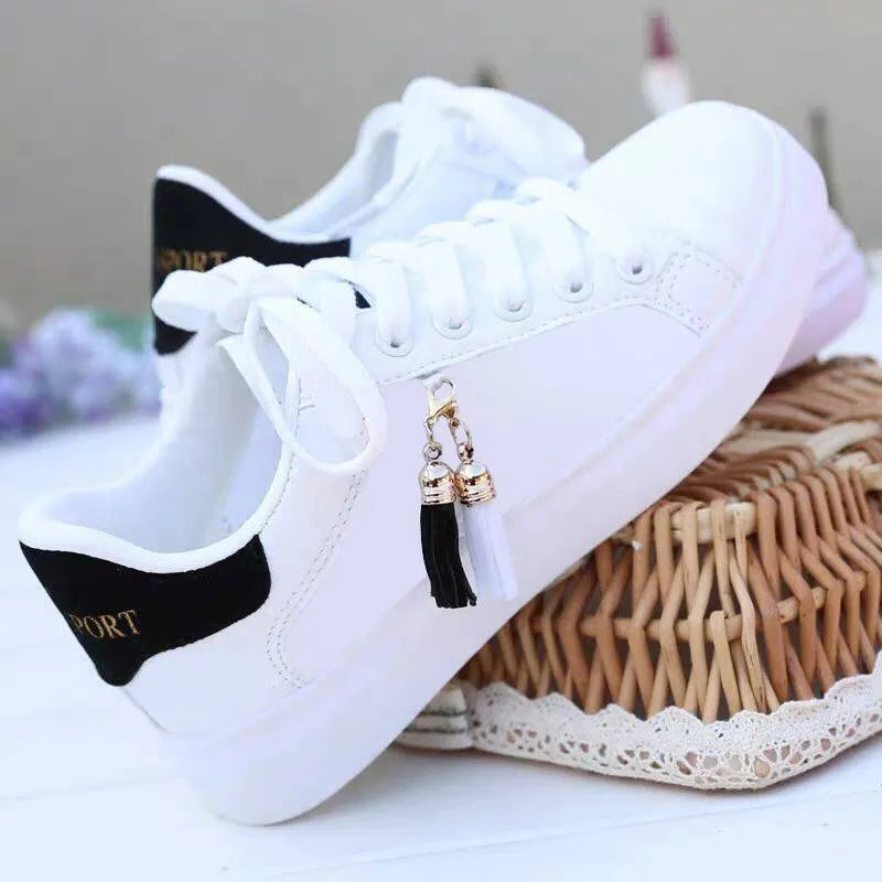 White mesh women's casual trainers with rubber sole on a pink background