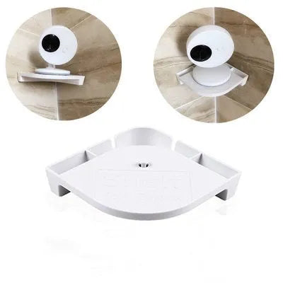 White UFO-shaped wireless baby monitor and camera on a nursery shelf.