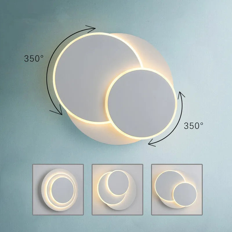 Modern round white acrylic LED wall lamp mounted on a wall