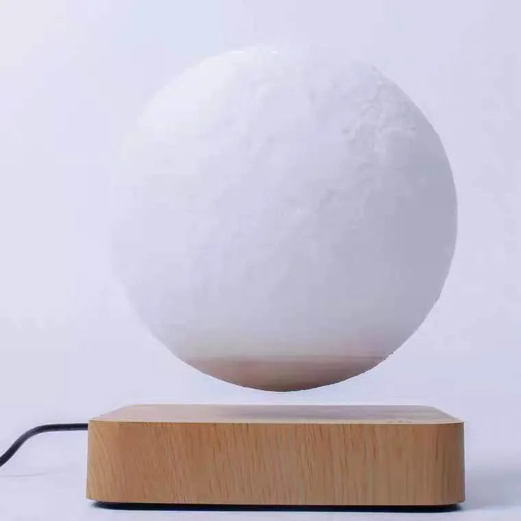 Magnetic levitation 3D moon night light, 14cm diameter, floating above a wooden base with touch switch.