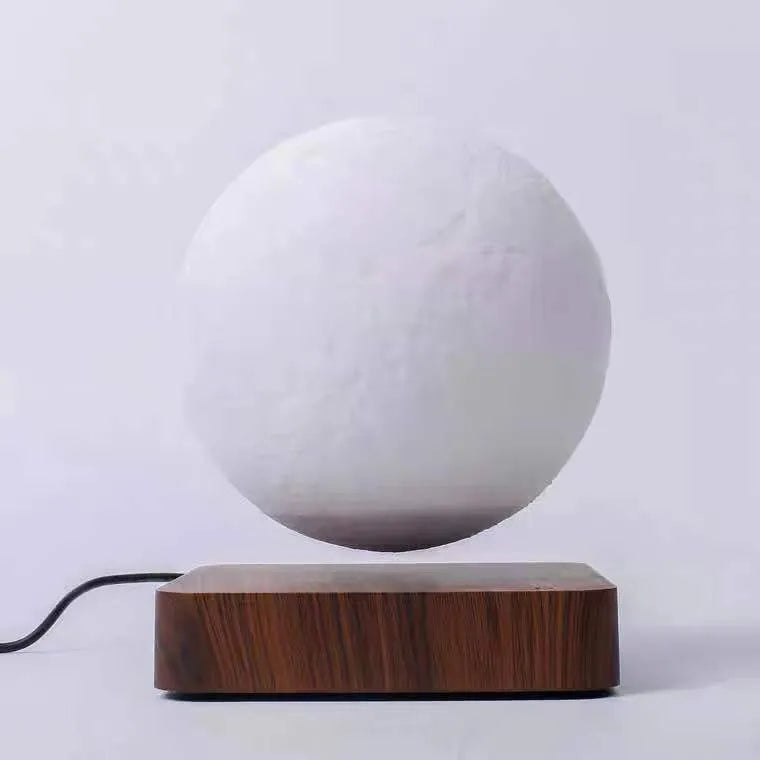 Magnetic levitation 3D moon night light, 14cm diameter, floating above a wooden base with touch switch.