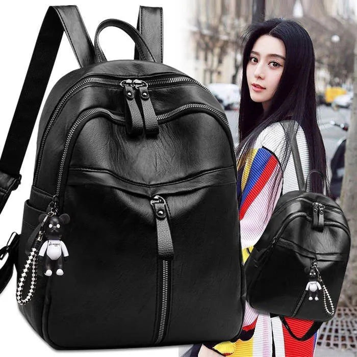 Black medium-sized PU leather backpack with double straps, shown with a 24cm dimension.