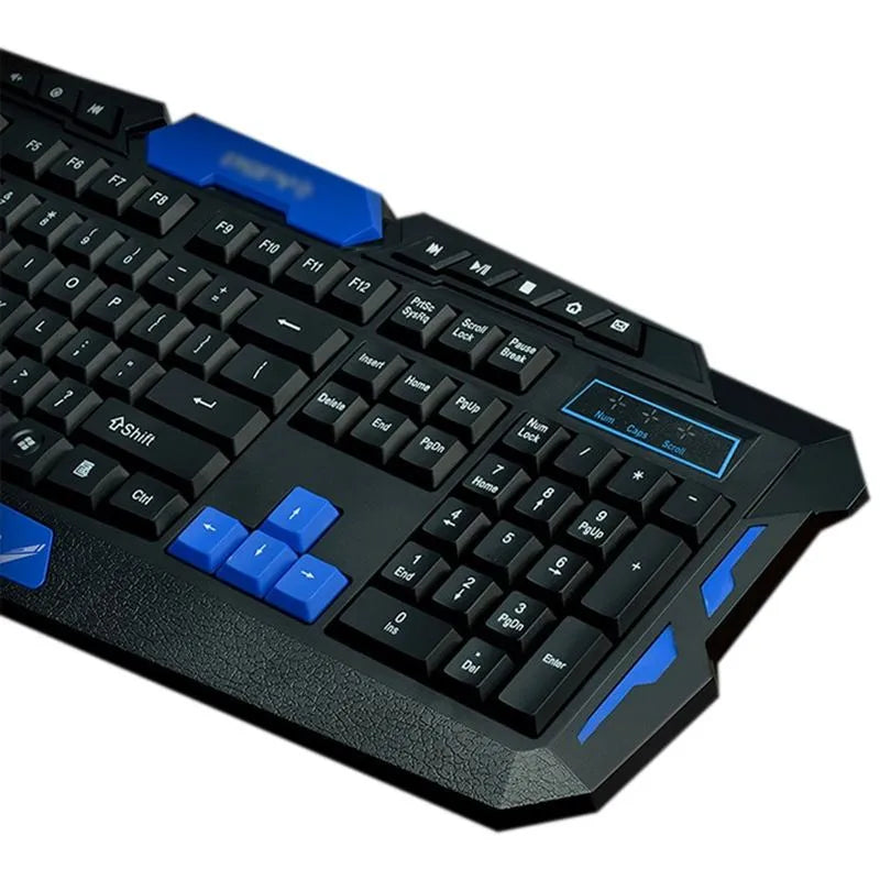 Black and blue wireless keyboard and mouse set on a desk.