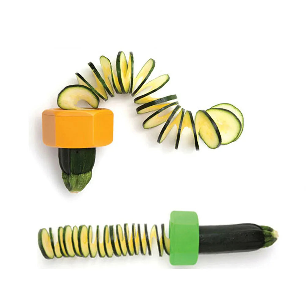 Yellow and green plastic vegetable spiral slicer for cucumbers on a kitchen counter.