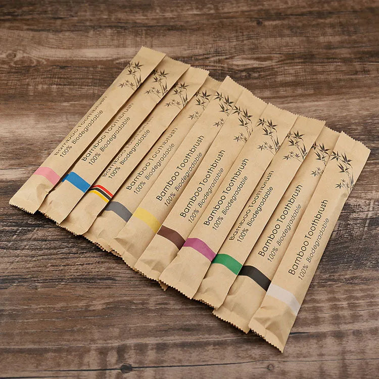 10 bamboo toothbrushes with charcoal bristles in multiple colours including green, black and purple