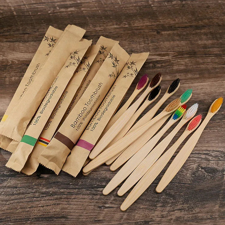 10 bamboo toothbrushes with charcoal bristles in multiple colours including green, black and purple