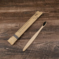 10 bamboo toothbrushes with charcoal bristles in multiple colours including green, black and purple