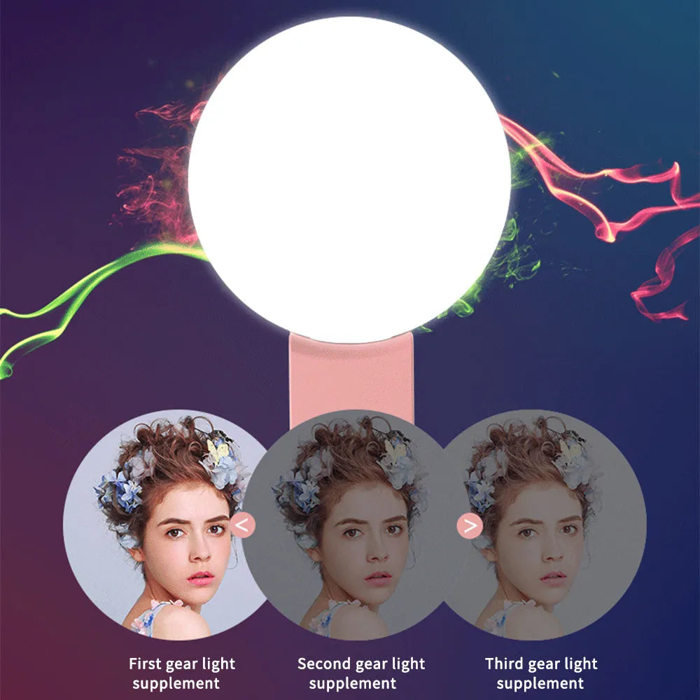 Mini clip-on LED fill light attached to mobile phone for selfie photography