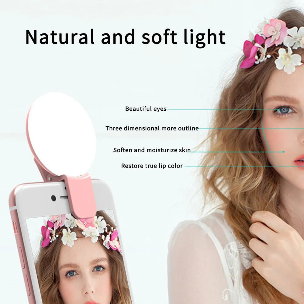 Mini clip-on LED fill light attached to mobile phone for selfie photography