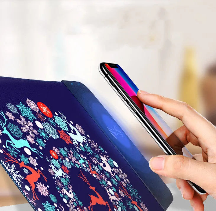 Cartoon design wireless charging mouse pad with RGB lighting, showing cloth surface and USB cable.