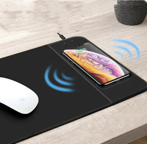 Cartoon design wireless charging mouse pad with RGB lighting, showing cloth surface and USB cable.