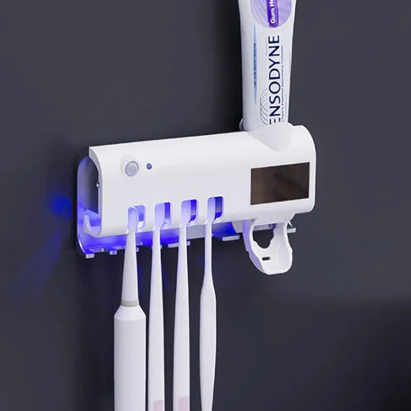 Black intelligent UV toothbrush steriliser with automatic toothpaste squeezer mounted on bathroom wall