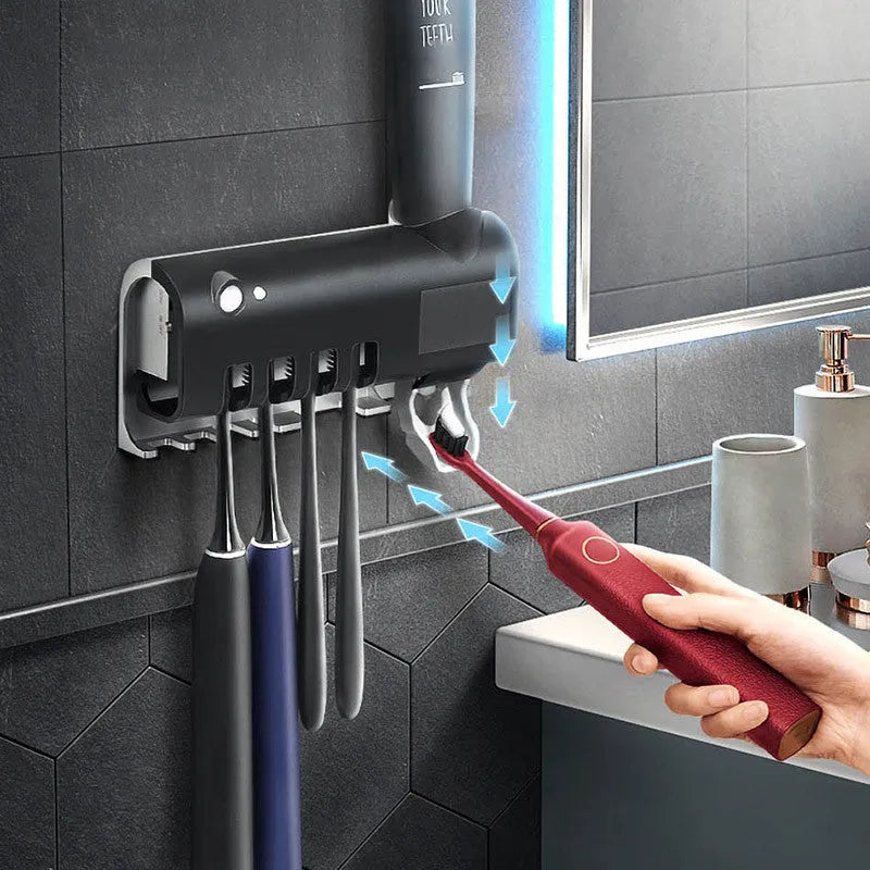 Black intelligent UV toothbrush steriliser with automatic toothpaste squeezer mounted on bathroom wall