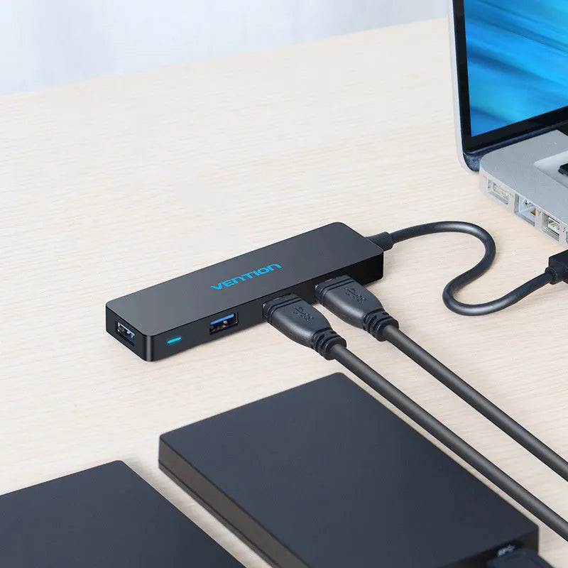 Black four-port USB 3.0 hub with GL 3510 chip and shielded cable