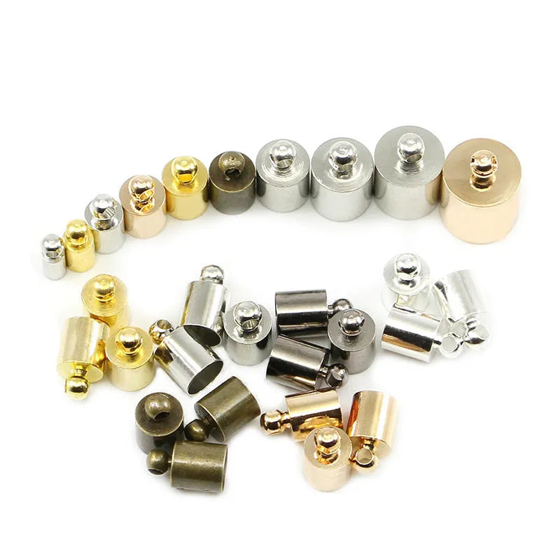 Assorted copper weight caps in different sizes and metallic colours for jewellery making.